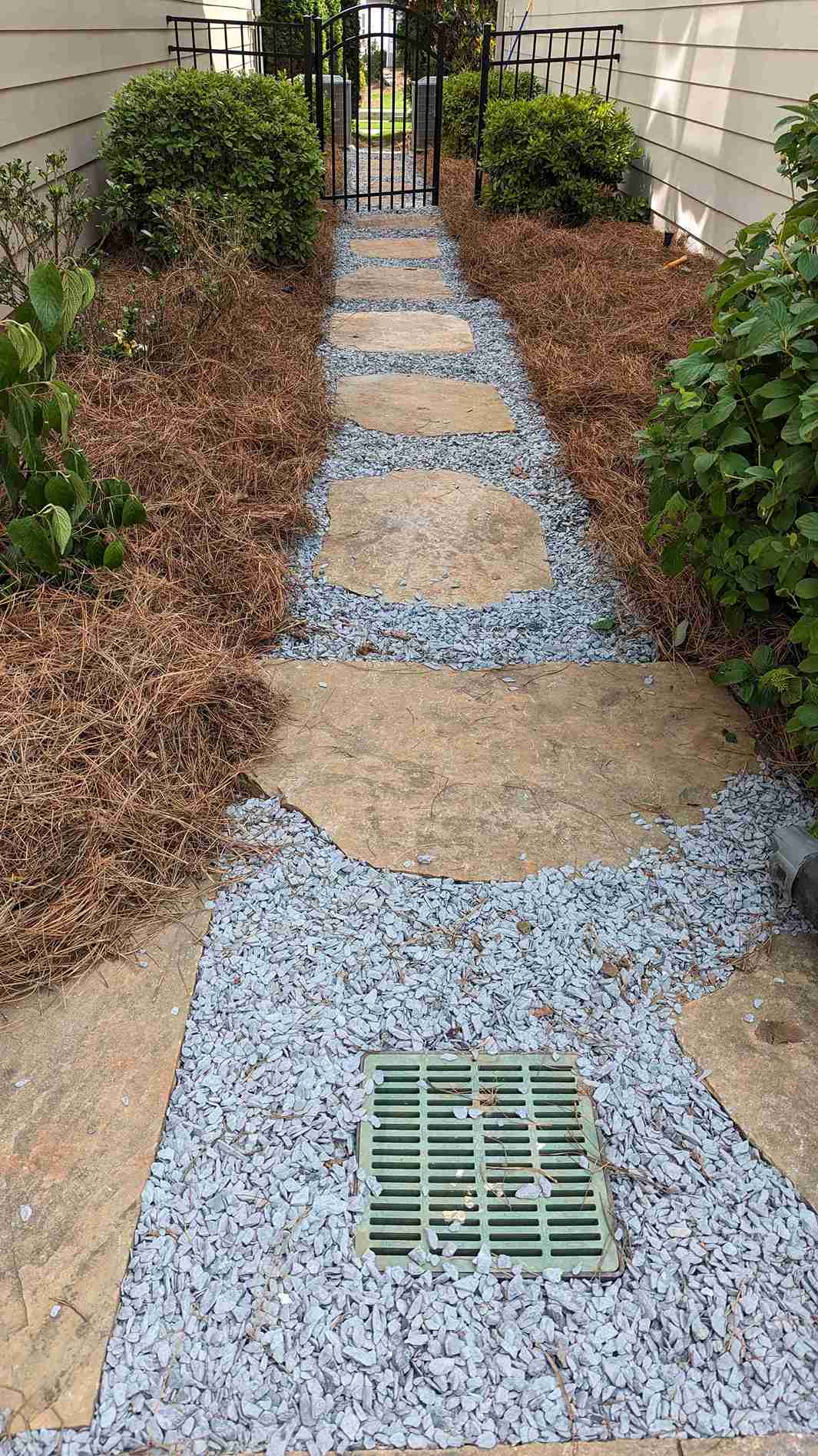 Paver walkway through a garden